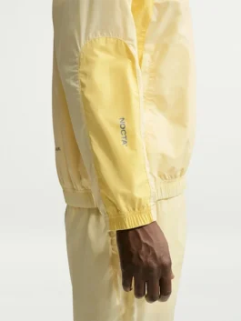 NOCTA Northstar Yellow Track Jacket right view with bright yellow polyester and sporty track styling