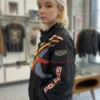 Off Campus Julia Sarah Stone Black Racing Jacket with sleek black fabric and sharp screen-inspired racing look