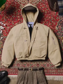Model wearing beige Shinzo Shige hooded canvas clasp bomber jacket with oversized streetwear fit