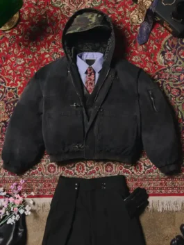 Black Shinzo Shige canvas clasp bomber jacket flat lay with trousers and accessories on patterned rug