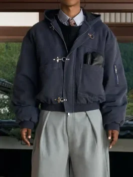 Model wearing navy blue Shinzo Shige canvas clasp bomber jacket with grey trousers