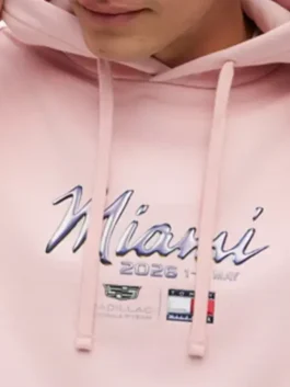 Tommy Hilfiger Cadillac F1 Miami Hoodie with pink fleece texture, F1 graphic artwork, and relaxed streetwear fit