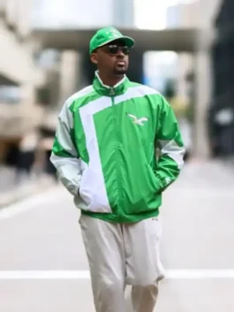 Front profile of the green and white HOMAGE x Starter Eagles Jacket in premium parachute fabric with a secure zipper closure.