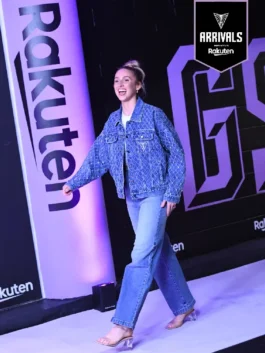 Eye-catching blue denim jacket with rhinestone details from the WNBA arrivals, highlighting premium construction.