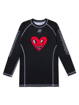 A&P x Keith Haring HEART LS Rashguard front view with black design, long sleeves, and signature artwork