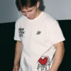 A&P x Keith Haring Hands Up Tee White front view with graphic artwork, white fabric, and casual streetwear style