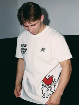 A&P x Keith Haring Hands Up Tee White front view with graphic artwork, white fabric, and casual streetwear style