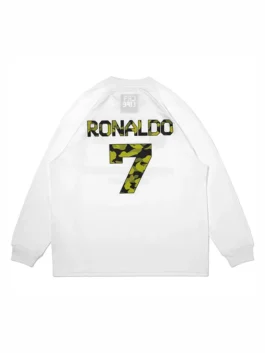 A professional lifestyle presentation of the white Bape X CR7 Life LS Football Jersey featuring full length sleeves.