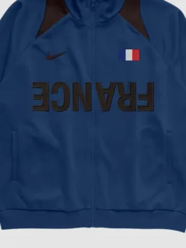 Cactus Jack Nike Total 90 France Anthem Jacket front closeup displaying premium fabric texture, detailed craftsmanship, and football-inspired styling