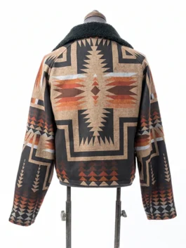Back view of a Western-style jacket on a mannequin, showcasing a large central Native American-inspired geometric starburst print.