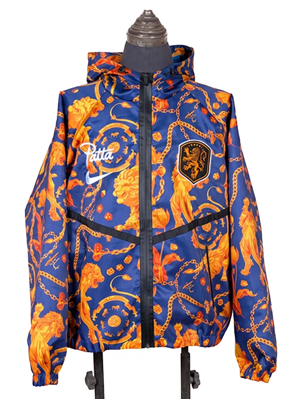 Frontal studio shot of the FIFA World Cup 2026 Netherlands Anthem Jacket on a mannequin, featuring a full-length black zipper, a dark chevron chest line, the official KNVB shield, and white athletic branding.