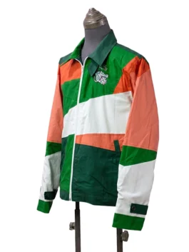 Left-angled view of a multi-colored sporty windbreaker jacket emphasizing the custom embroidered crocodile patches and the adjustable sleeve cuff straps.