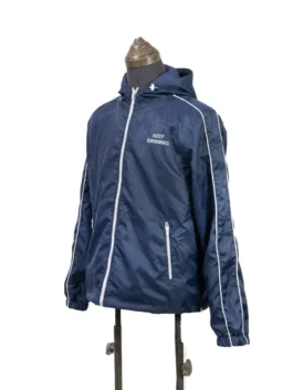A vibrant blue BTS Keep Swimming Blue Jacket crafted from premium nylon fabric with a full front zipper closure.