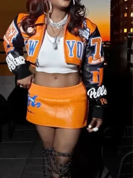 Orange and black Remy Ma Knicks Cropped Leather Jacket worn by Remy Ma celebrating New York Knicks culture and street pride
