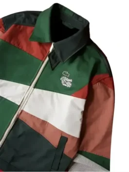 The custom layout of the lacoste mexico jacket highlighting the unique multicolor aesthetic and two functional outside pockets.