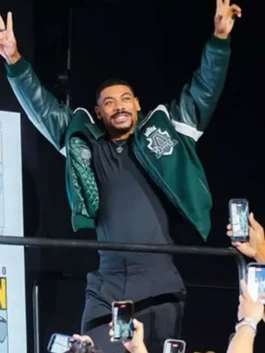Green wool body with leather sleeves Comic-Con 2026 Aaron Pierre Varsity Jacket featuring a shirt style collar and zipper button closure.