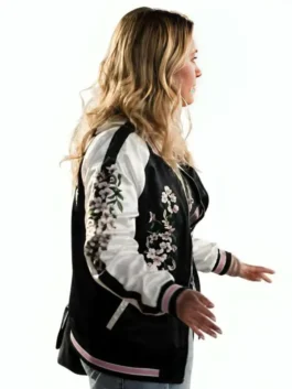Front view of the black and white All Night Wrong Maria Bakalova Varsity Jacket showcasing floral patterns and rib knitted cuffs.
