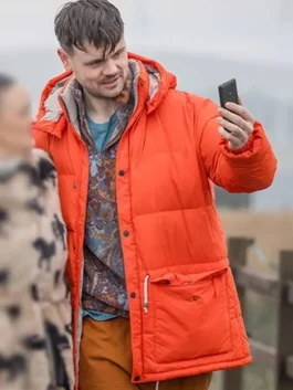 Close-up of the orange parachute fabric Brassic Tom Hanson Puffer Hooded Jacket showcasing the hooded collar and padded puffer design.