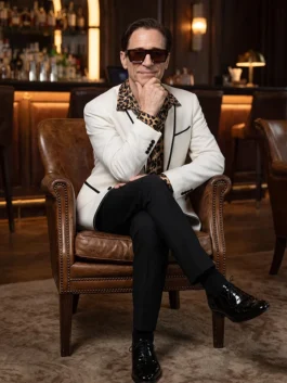 Model wearing the Christopher Gattelli White Blazer made of suiting fabric with stylish black piping details.