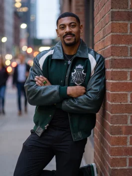 Green wool body with leather sleeves Comic-Con 2026 Aaron Pierre Varsity Jacket highlighting four practical storage pockets.