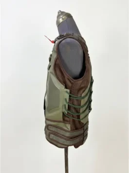 Side profile of the Dark Knight Rises Bane Vest displaying the adjustable fastening straps and edge stitching.