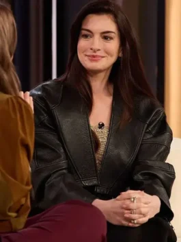 Cropped black real leather Drew Barrymore Show Anne Hathaway Jacket featuring an open style closure and collarless neckline.