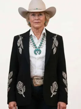 Close-up front view of the black suiting Dutton Ranch Annette Bening Floral Blazer detailing the lapel collar and front buttoning.