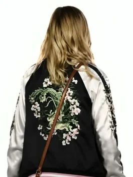 Back view of the black and white satin All Night Wrong Maria Bakalova Varsity Jacket showing clean ribbed trims and floral motif.