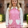 Elle Lexi Minetree Hearts Pocket Pink Varsity Jacket front view featuring premium varsity styling, heart pocket detailing, and soft pink fashion
