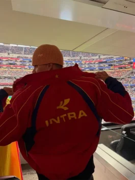 Back view of the red cotton Harper Beckham Intra Spain Jacket showcasing a clean drape and quality stitching.