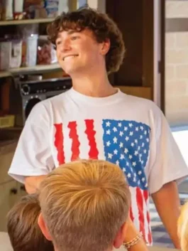 Front view of the white Gabriel LaBelle Snack Shack USA Flag T-Shirt showing the round neck and pullover fit.