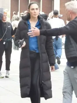 Close-up front view of the black Gal Gadot The Runner Puffer Coat detailing the stand-up collar and smooth zip closure.