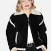 Close-up of the black wool Gigi Hadid Guest In Residence Seoul Opening Jacket detailing the turn down collar and zip closure.