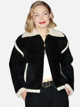 Close-up of the black wool Gigi Hadid Guest In Residence Seoul Opening Jacket detailing the turn down collar and zip closure.