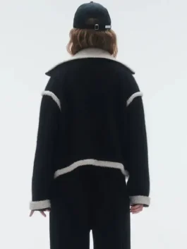 Black wool Gigi Hadid Guest In Residence Seoul Opening Jacket highlighting three practical storage pockets.