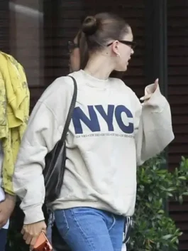 Full front view of the grey fleece Hailey Bieber NYC Sweatshirt displaying its relaxed oversized fit and long sleeves.