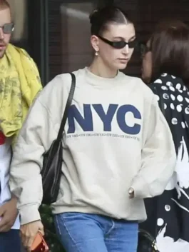 Close-up front profile of the grey fleece Hailey Bieber NYC Sweatshirt detailing the round neck collar and fine stitching.