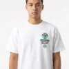 Model wearing the crisp white Hidden NY FIFA World Cup Final T-Shirt in a relaxed street-style setting.