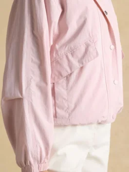 Side view of Hove Pink Waterproof Windbreaker Jacket featuring a lightweight fit and waterproof outdoor design