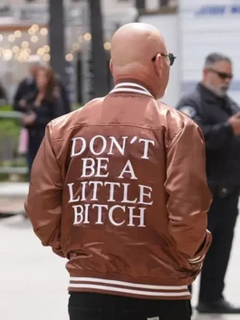 Rear profile view of the brown satin Howie Mandel America’s Got Talent Brown Jacket showcasing clean paneling and rib knitted cuffs.