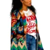 A professional shot of the Keke Palmer The Burbs 2026 Multicolor Cardigan featuring full length sleeves and belted waist.