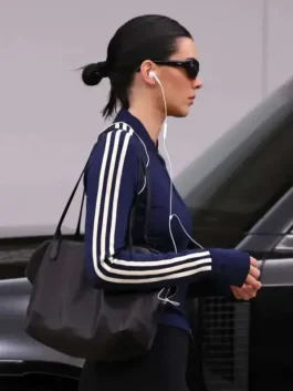 Close-up front profile of the navy blue fleece Kendall Jenner 2026 Navy Blue Jacket detailing the rib knitted collar and zip front.