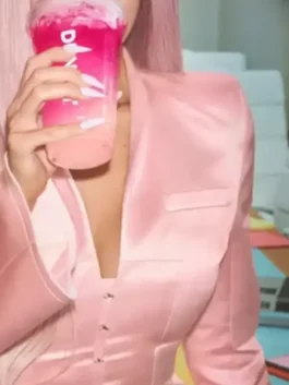 view of the pink satin Kylie Jenner Dunkin Donuts Pink Blazer showing the button closure and sleek fit.