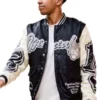 Front view of the black and white Lamine Yamal Teddy 2026 Varsity Jacket showcasing full length sleeves and rib knitted cuffs.
