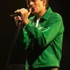 Full view of the green cotton Louis Tomlinson Human Made Jacket highlighting three practical storage pockets.