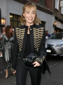 Close-up front view of the black cotton Margot Robbie Embroidered Jacket detailing the stand up collar and elegant embroidery.