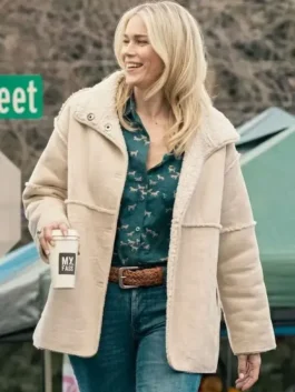Front view of the beige suede Marshals Dolly Weaver Beige Shearling Jacket showcasing full length sleeves and shearling trim.