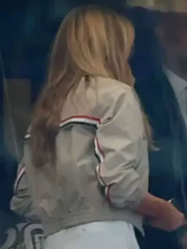 Back profile of the beige Melania Trump World Cup Final Jacket showing clean tailored stitching and elastic cuffs.