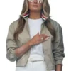 Front view of the beige cotton Melania Trump World Cup Final Jacket highlighting the zip front and minimalist design.