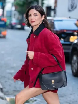 Monica Barbaro New York City 2026 Jacket in red cotton fabric with a shirt style collar and front button closure.